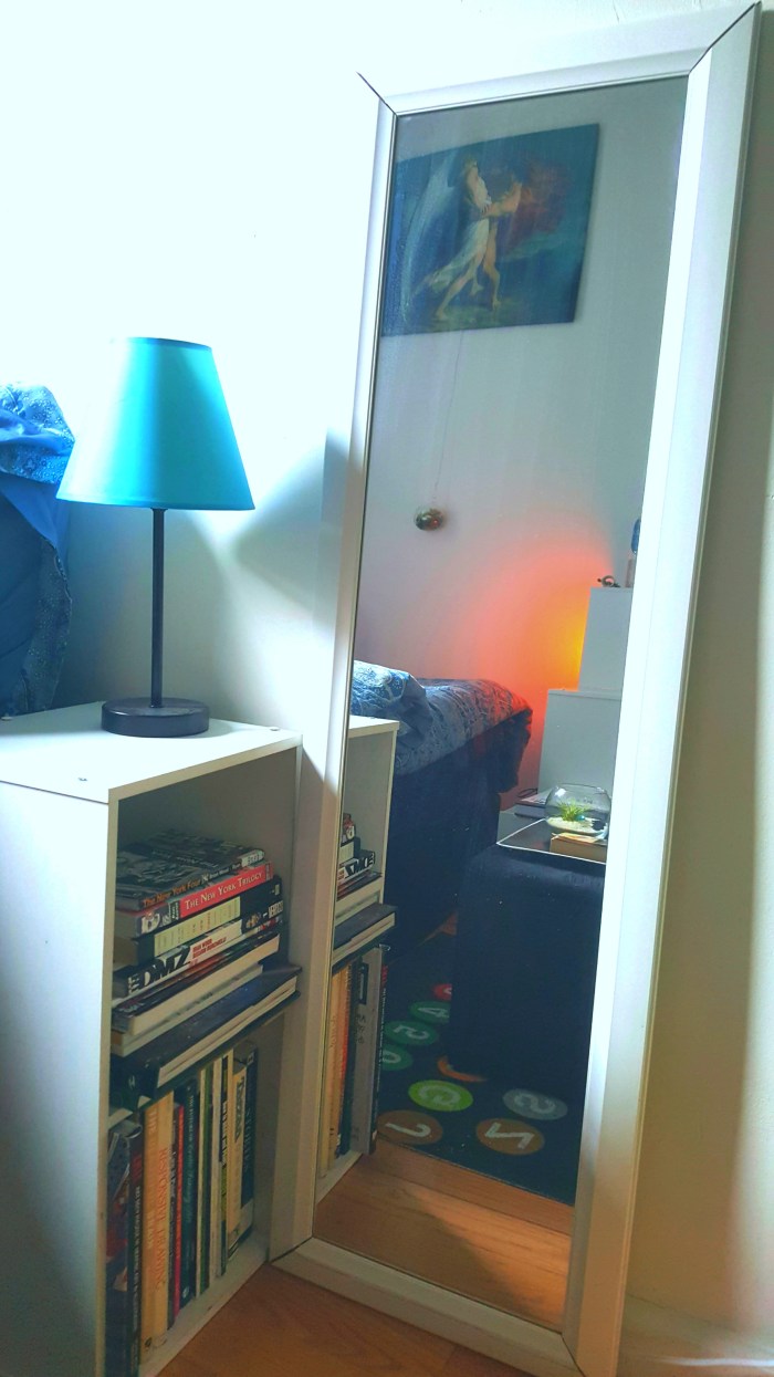 Mirror and bookshelf with nightlamp